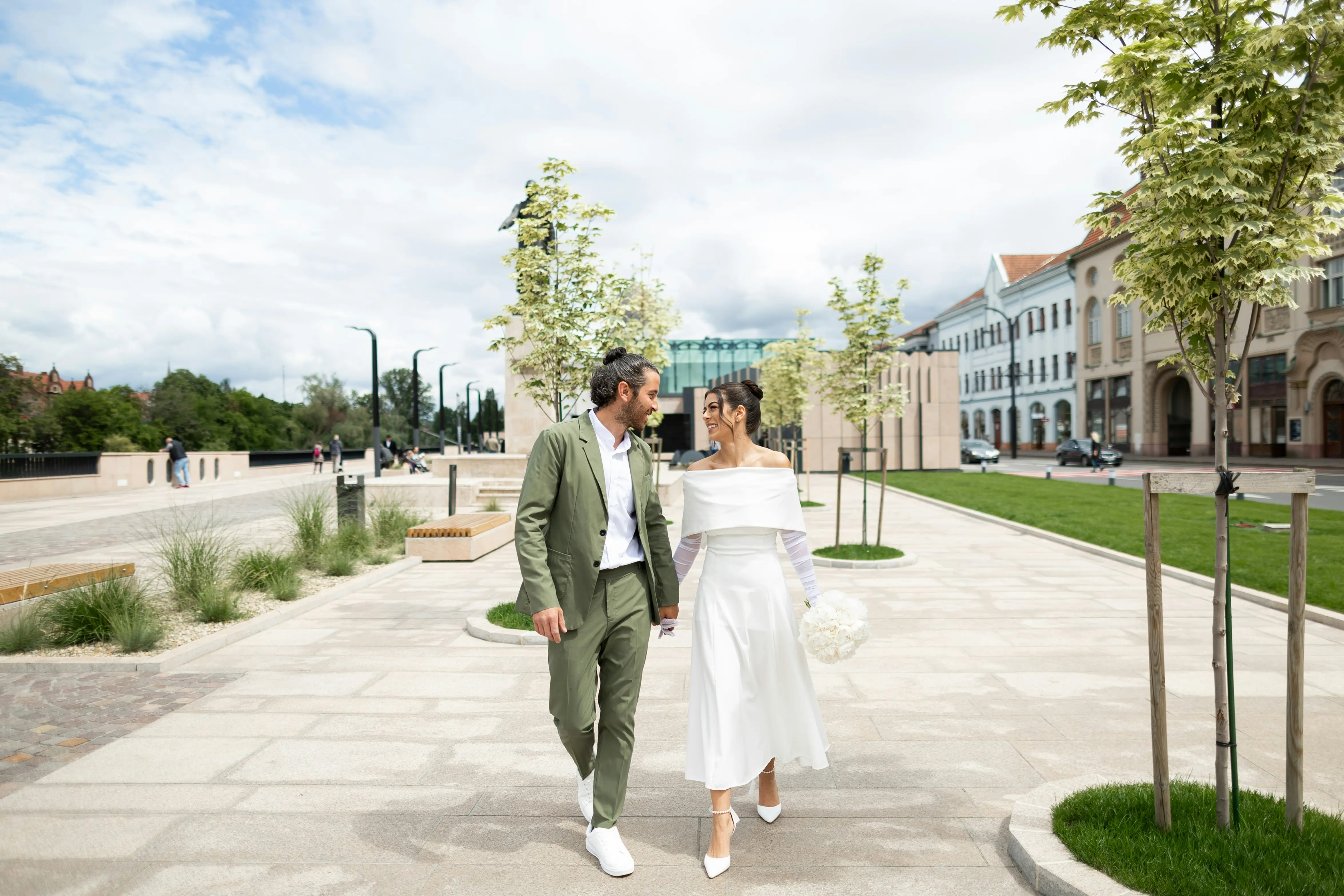 Newly married couple walking together after their wedding