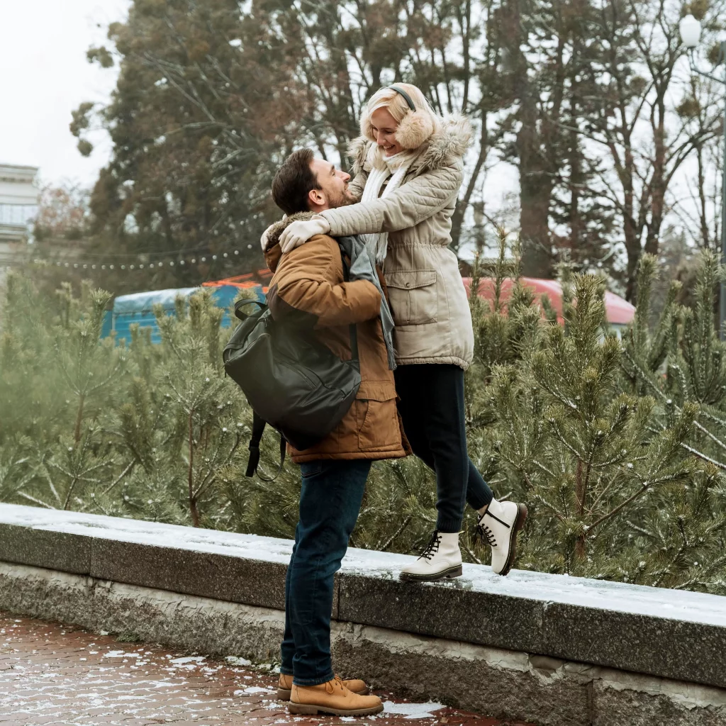couple winter looking each other